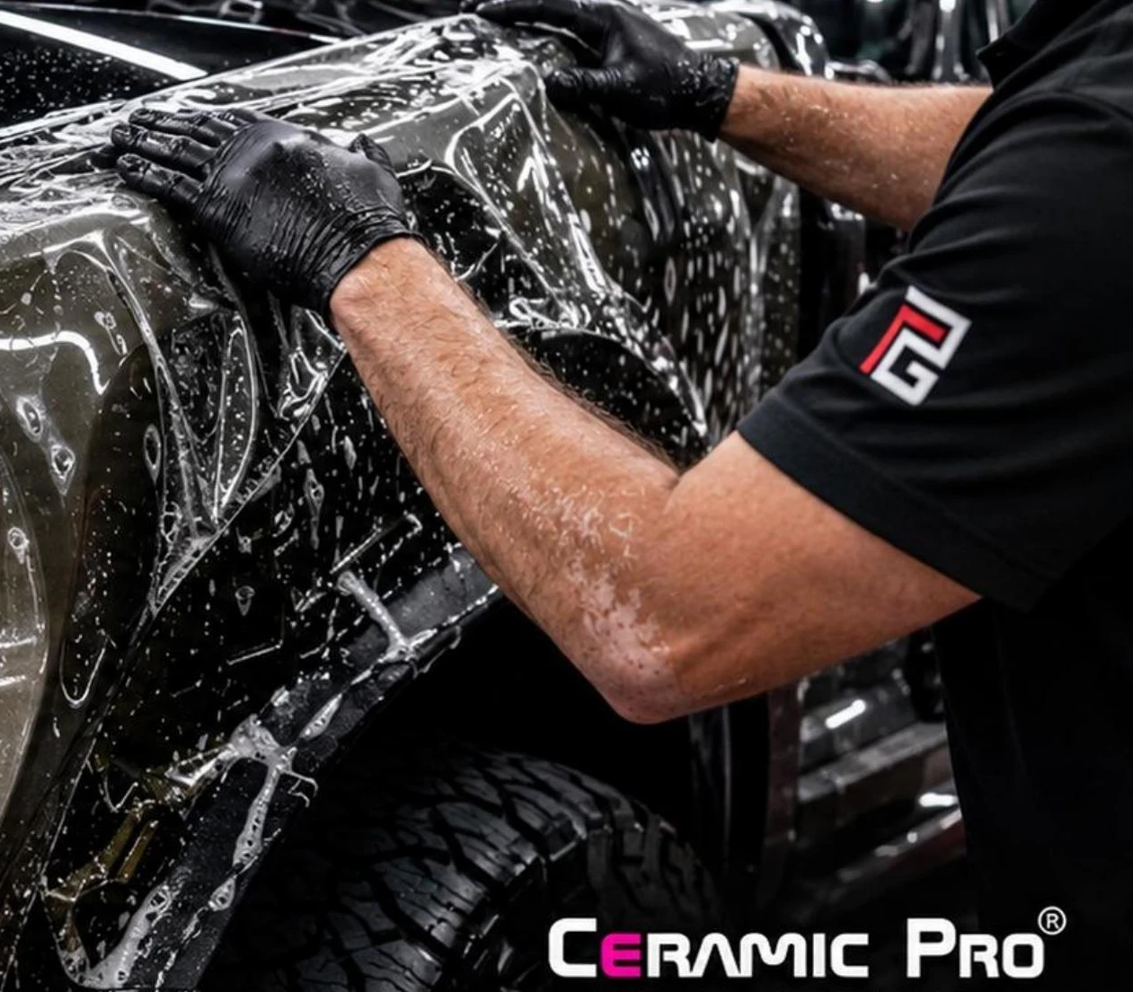 PROGUYS installer fitting paint protection film on a truck fender